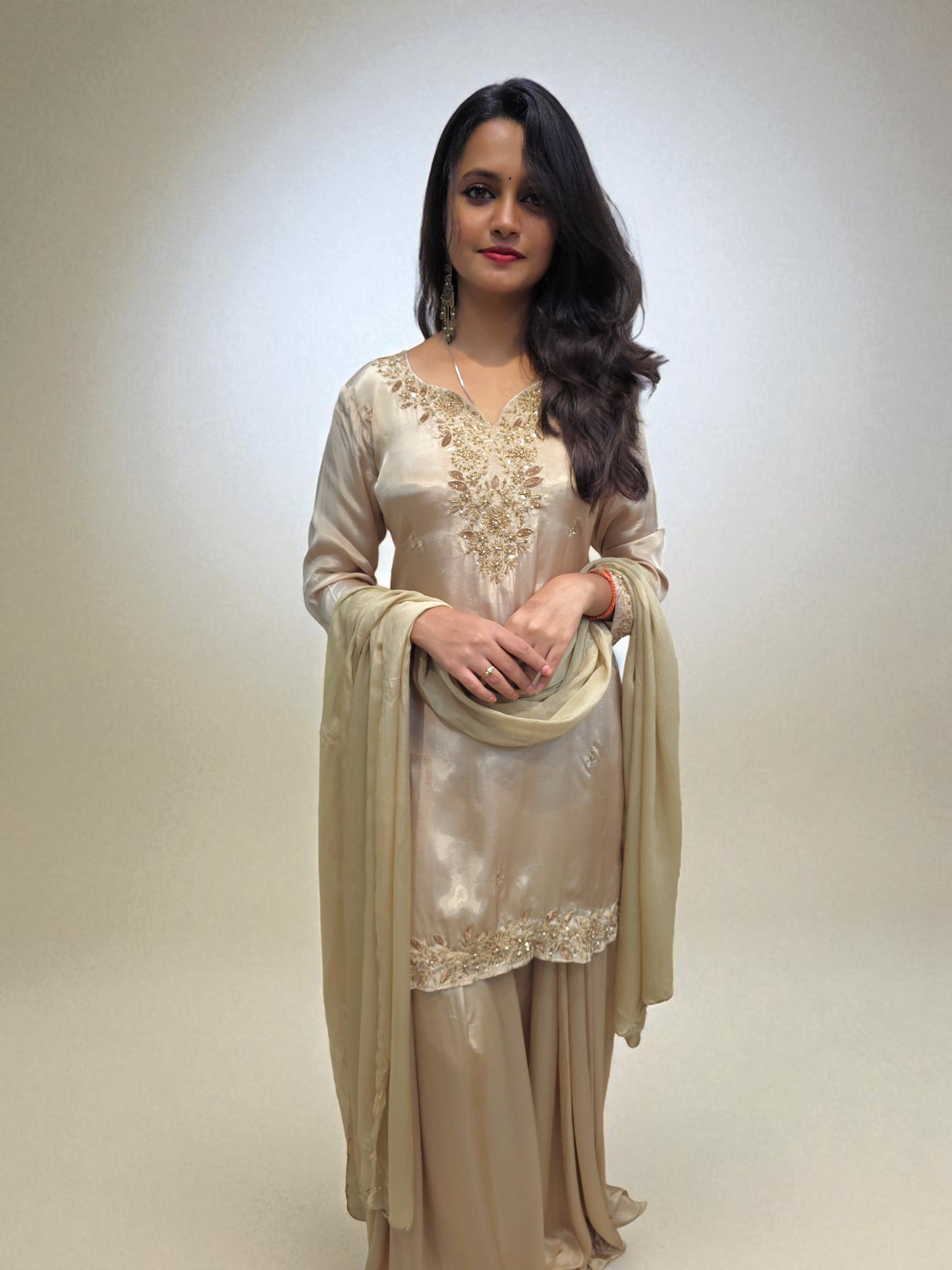 Festive beige crepe silk kurta and palazzo set with handwork detailing