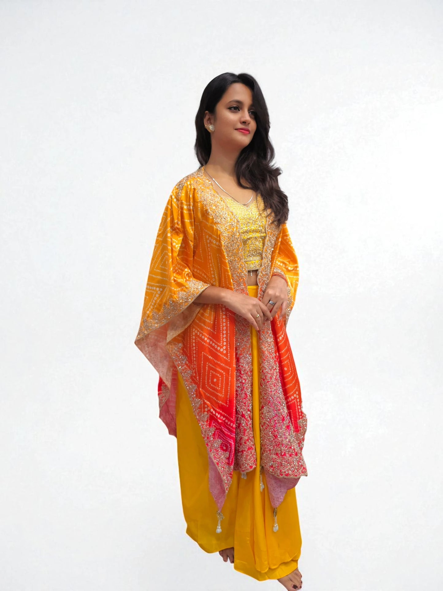 Stylish festive dhoti skirt for women in yellow with embroidered blouse and Cape