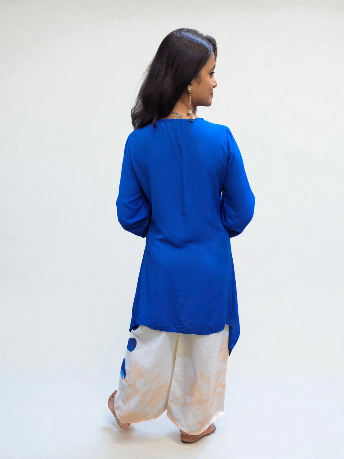 back view of Modern Indo-Western outfit featuring blue C-cut top and printed pants, perfect for festive or casual wear.
