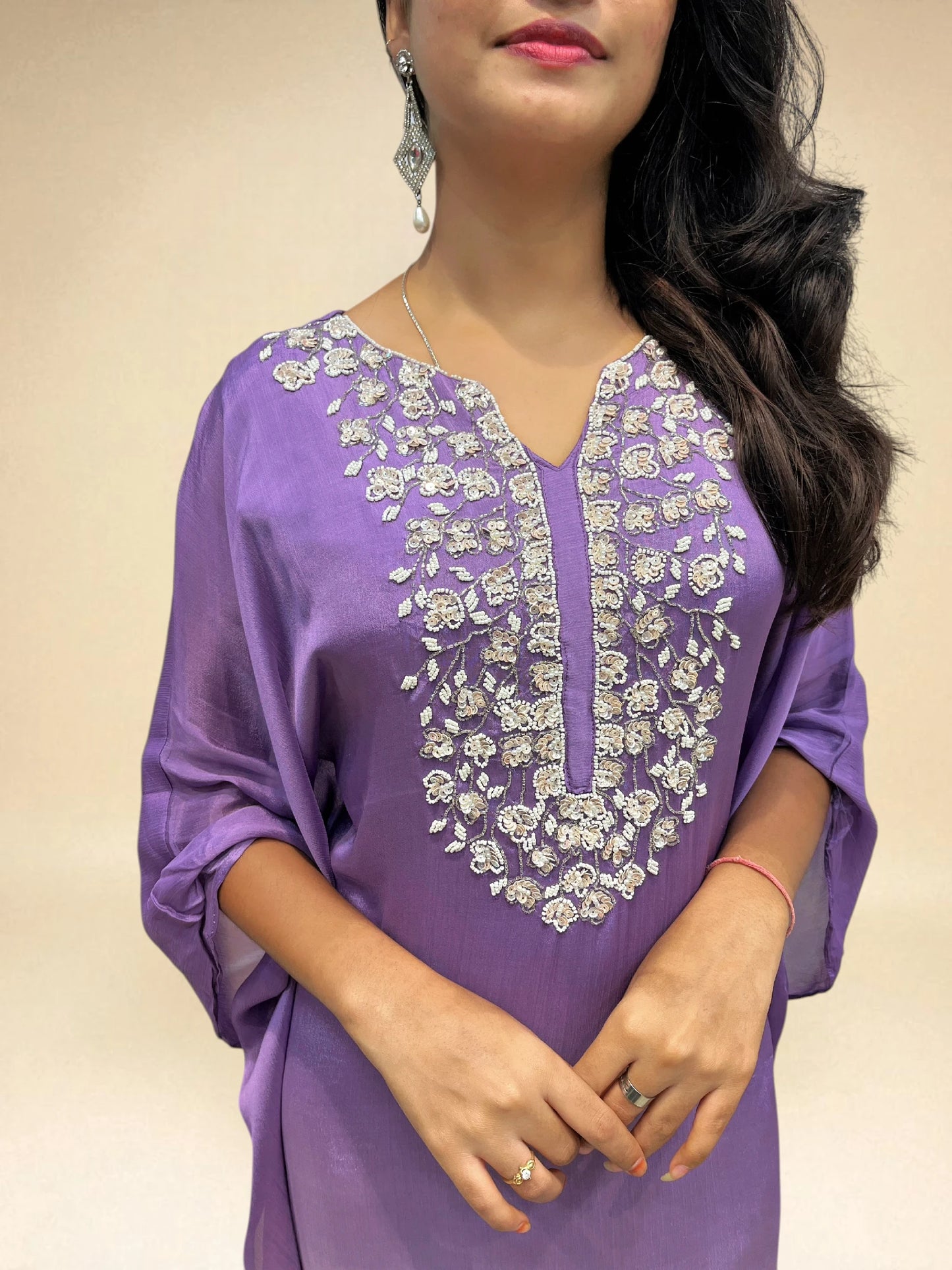 closeup view of purple white kaftan set with floral hand work from ambika boutique