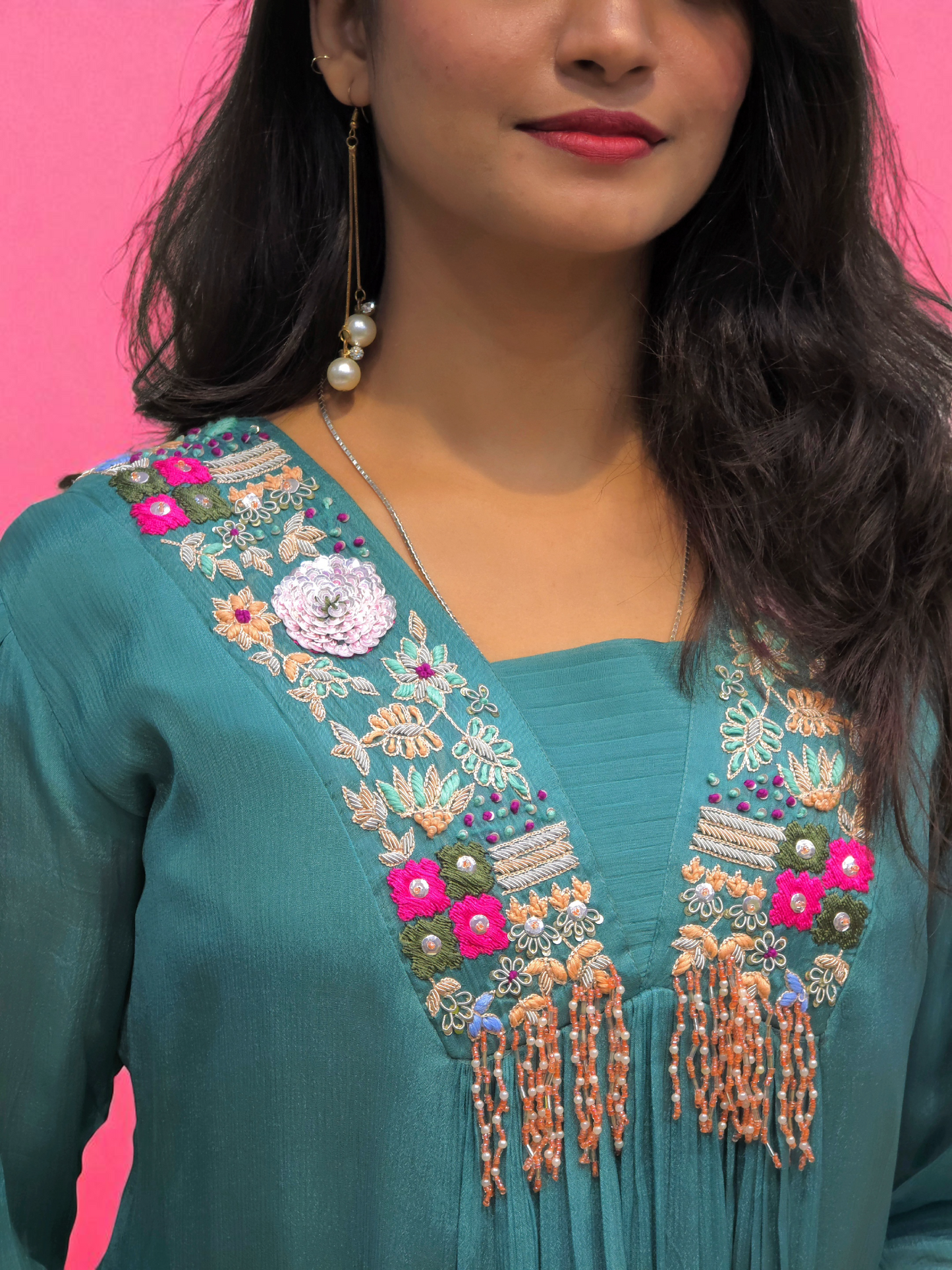 close up of Designer teal kurti set with colorful hand embroidery and palazzo– party wear Indo-Western look for women