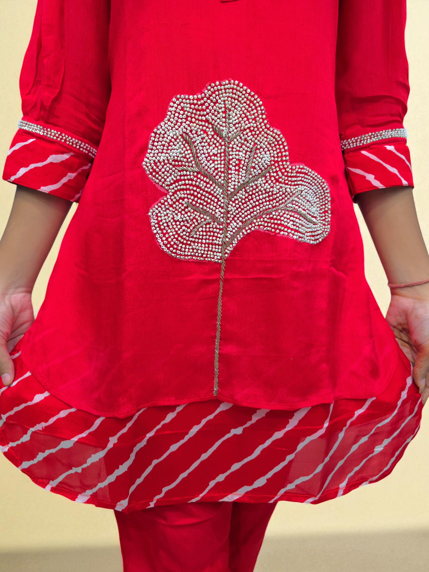 close up of Red co-ord set for women featuring leheriya print and embroidered kurti – perfect festive outfit from Ambika Boutique