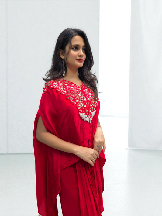 Woman in Designer Black Cape with Hand Embroidery, showcasing festive elegance and style by Ambika Boutique.