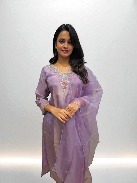 Elegant woman in a lavender kurta set with handwork and organza dupatta, perfect for party wear from Ambika Boutique.