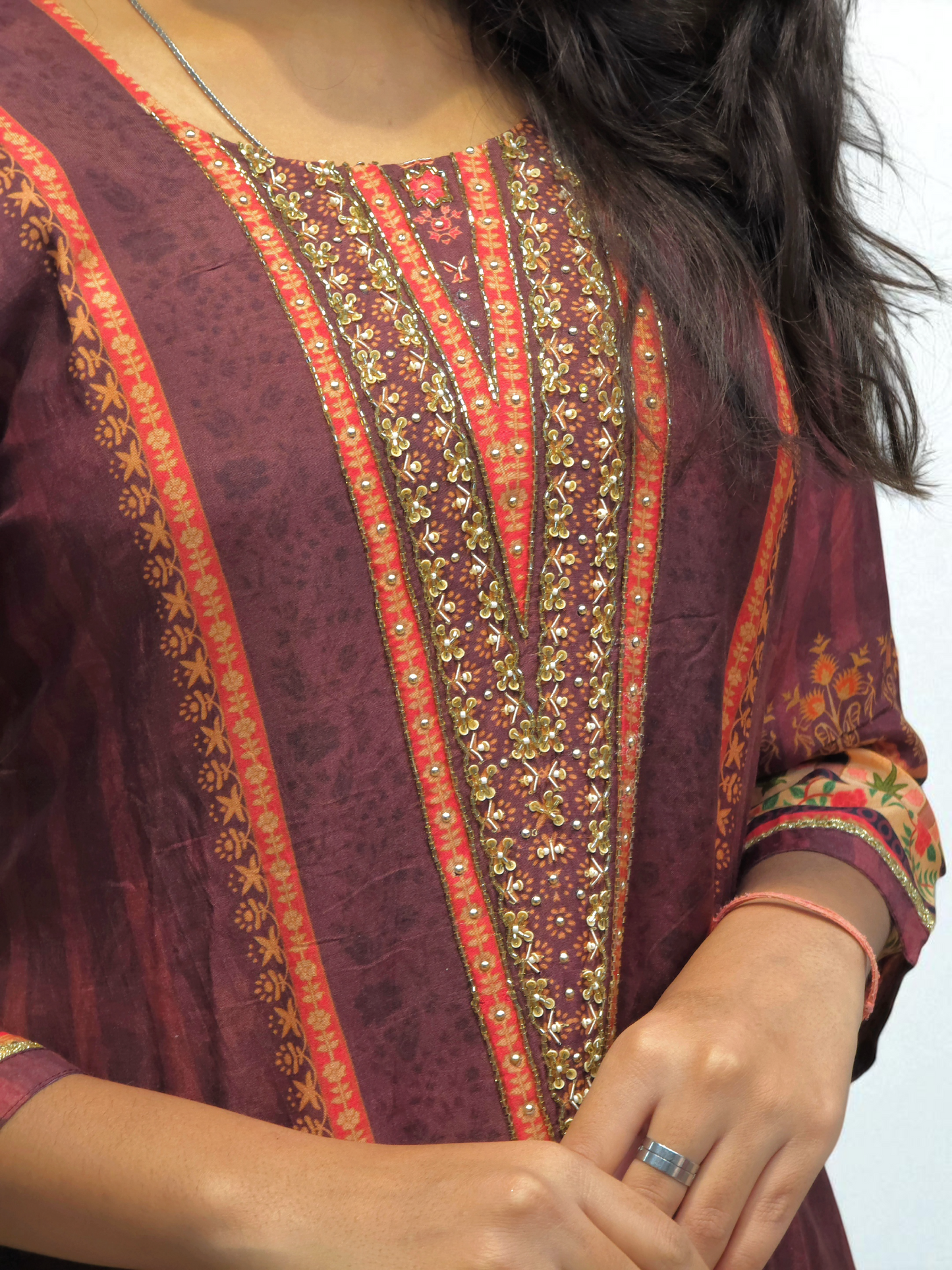 close up of Woman wearing maroon and red printed set with dupatta – traditional ethnic wear for festive occasions from Ambika Boutique