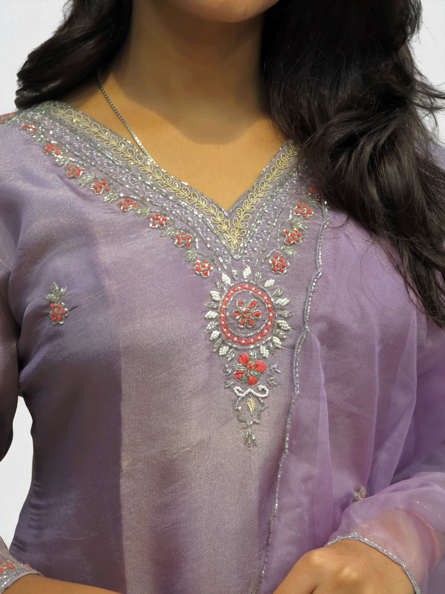 Elegant purple kurta set featuring intricate handwork and shimmering fabric, perfect for party wear and special occasions.