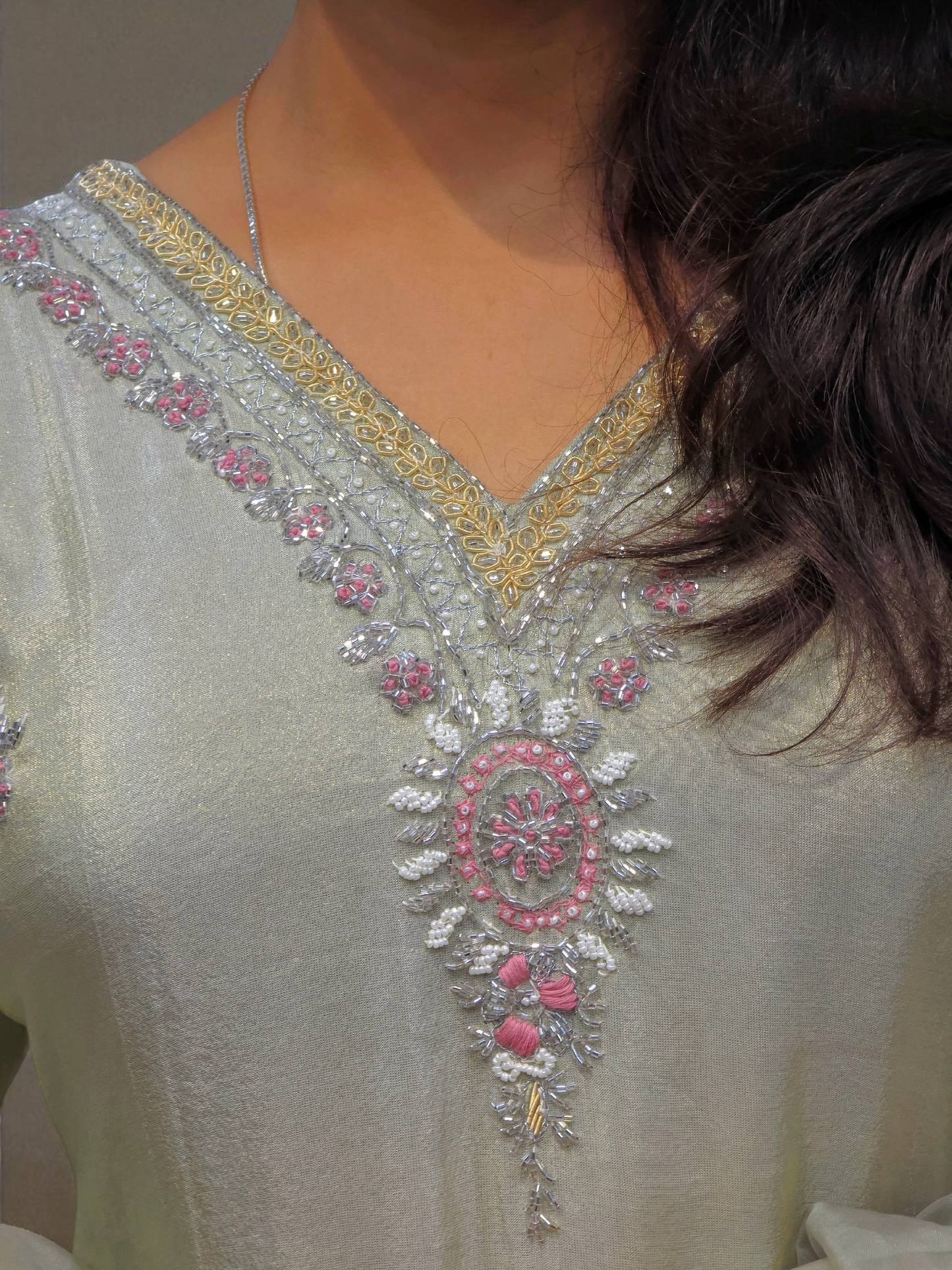 Elegant ivory kurta set featuring intricate handwork and shimmering fabric, perfect for party wear and special occasions.