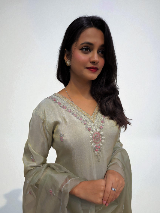 Model wearing a ivory handwork kurta set featuring exquisite embroidery, perfect for party wear and special occasions.