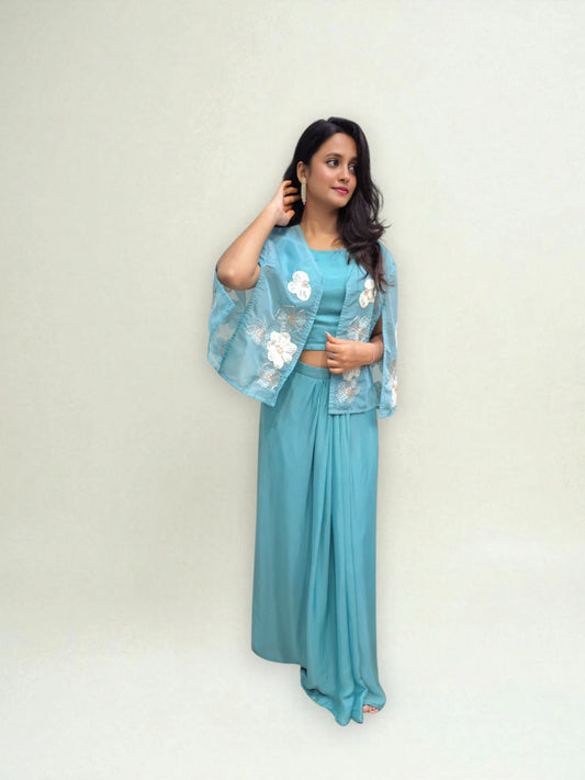 Blue crop top with dhoti skirt and organza shrug featuring applique handwork – Ambika Boutique