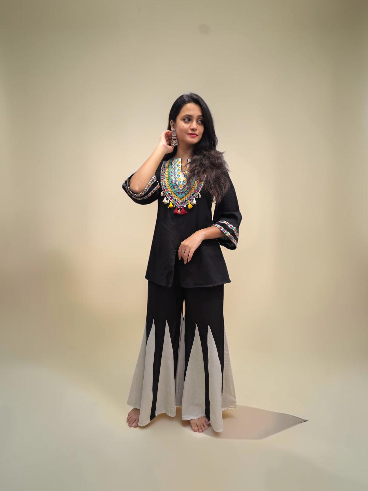 Designer black co-ord set featuring colorful embroidered neckline