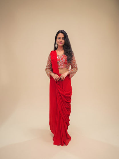 Designer rust orange drape saree with embroidered crop blouse