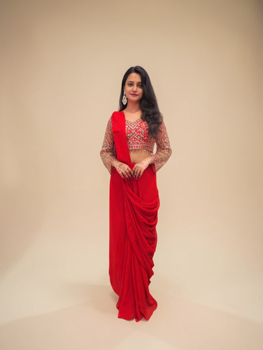 Designer rust orange drape saree with embroidered crop blouse