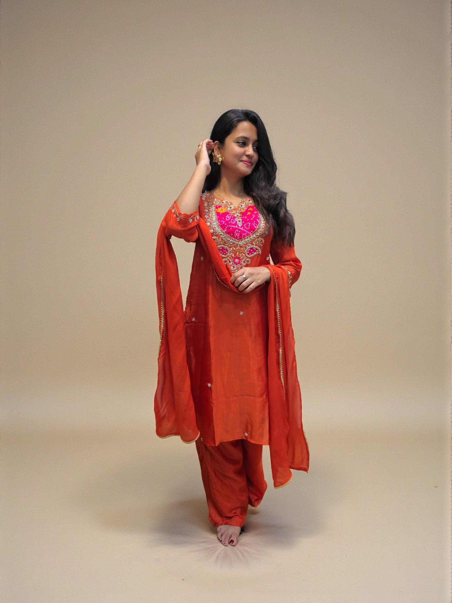 Women’s rust orange kurta palazzo set with intricate handwork