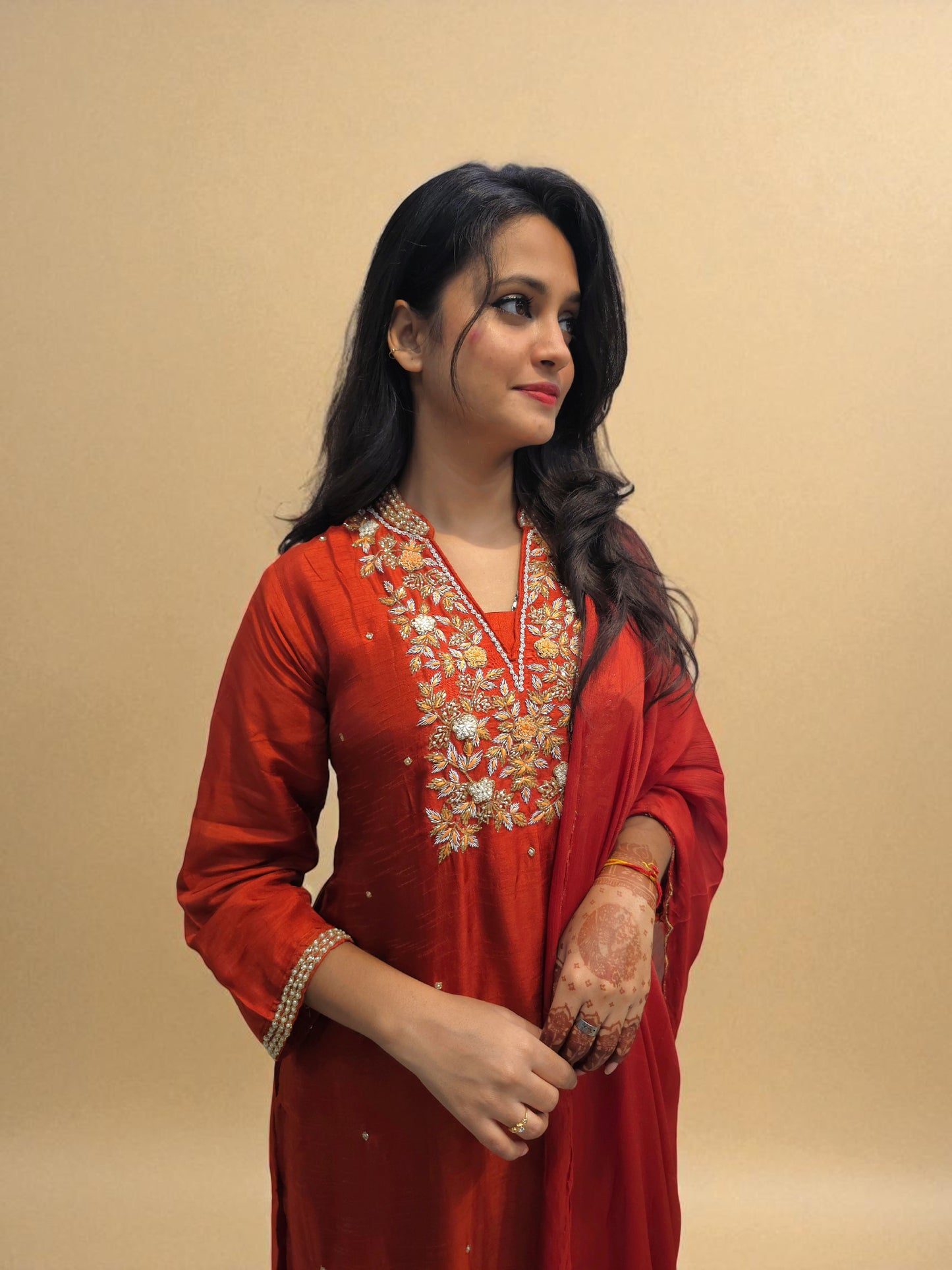 Designer rust orange ethnic wear with intricate embroidery and dupatta
