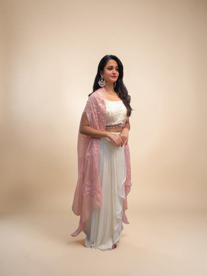 Elegant white dhoti skirt set with embroidered pink shrug