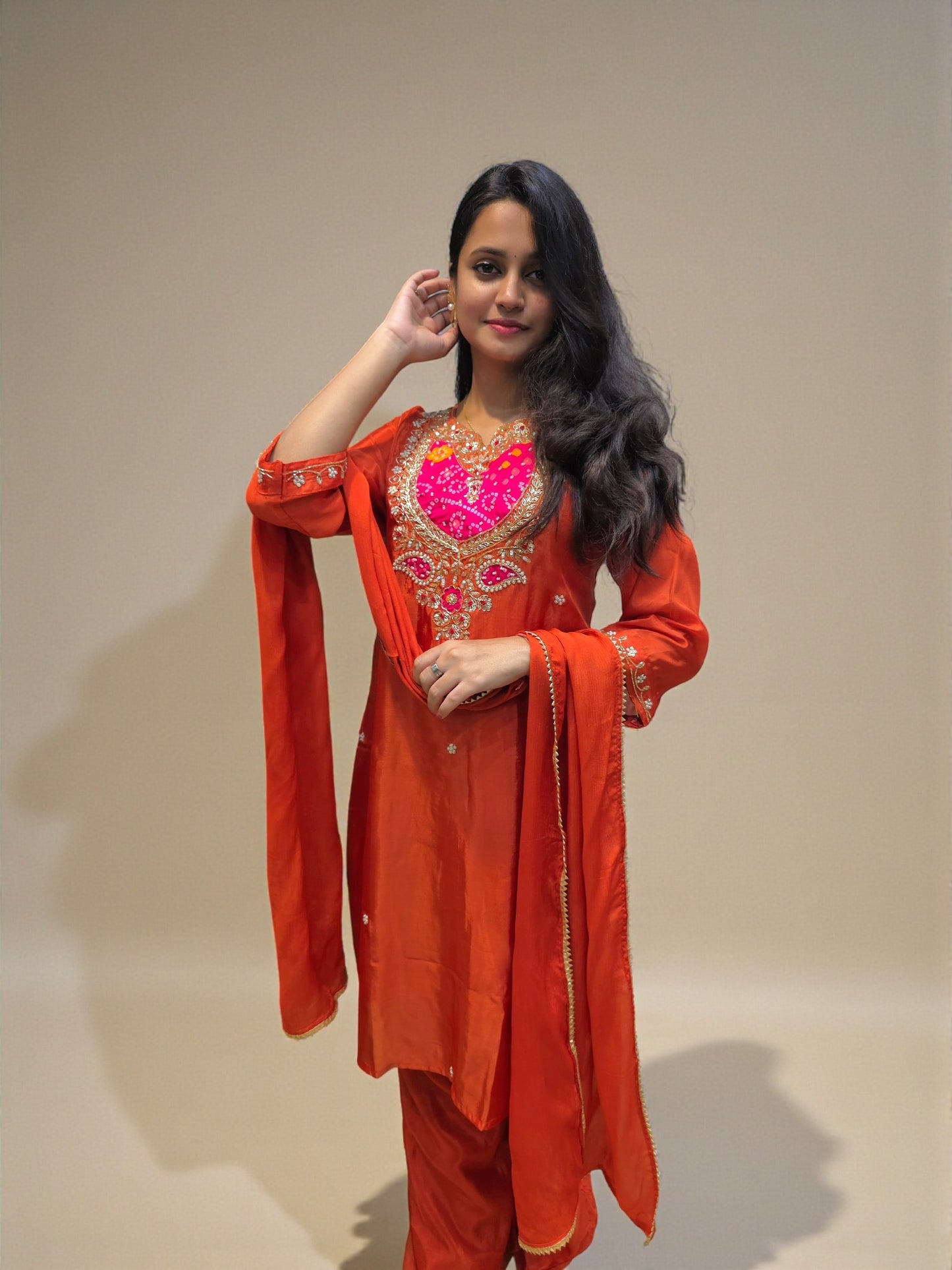 Elegant rust orange kurta palazzo set with traditional embroidery