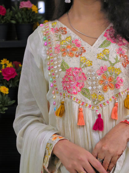Off white festive kurta suit with delicate embroidery detailing