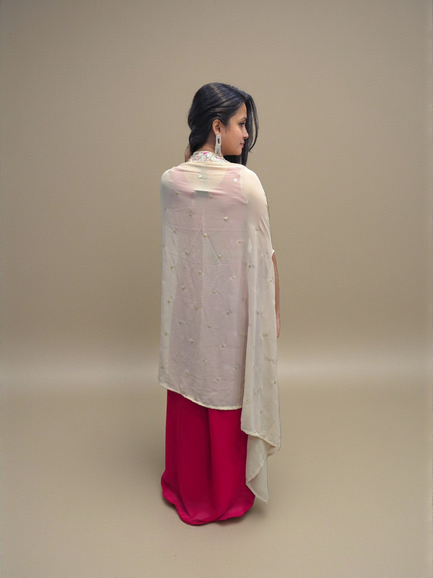 Back view of Embroidered crop top paired with maroon dhoti skirt and beige shrug