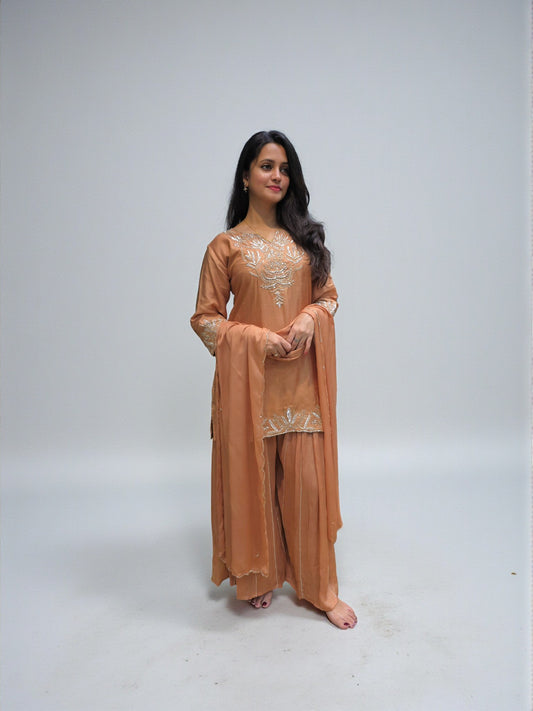 Hand embroidered zardozi short kurta palazzo suit in camel peach shade
