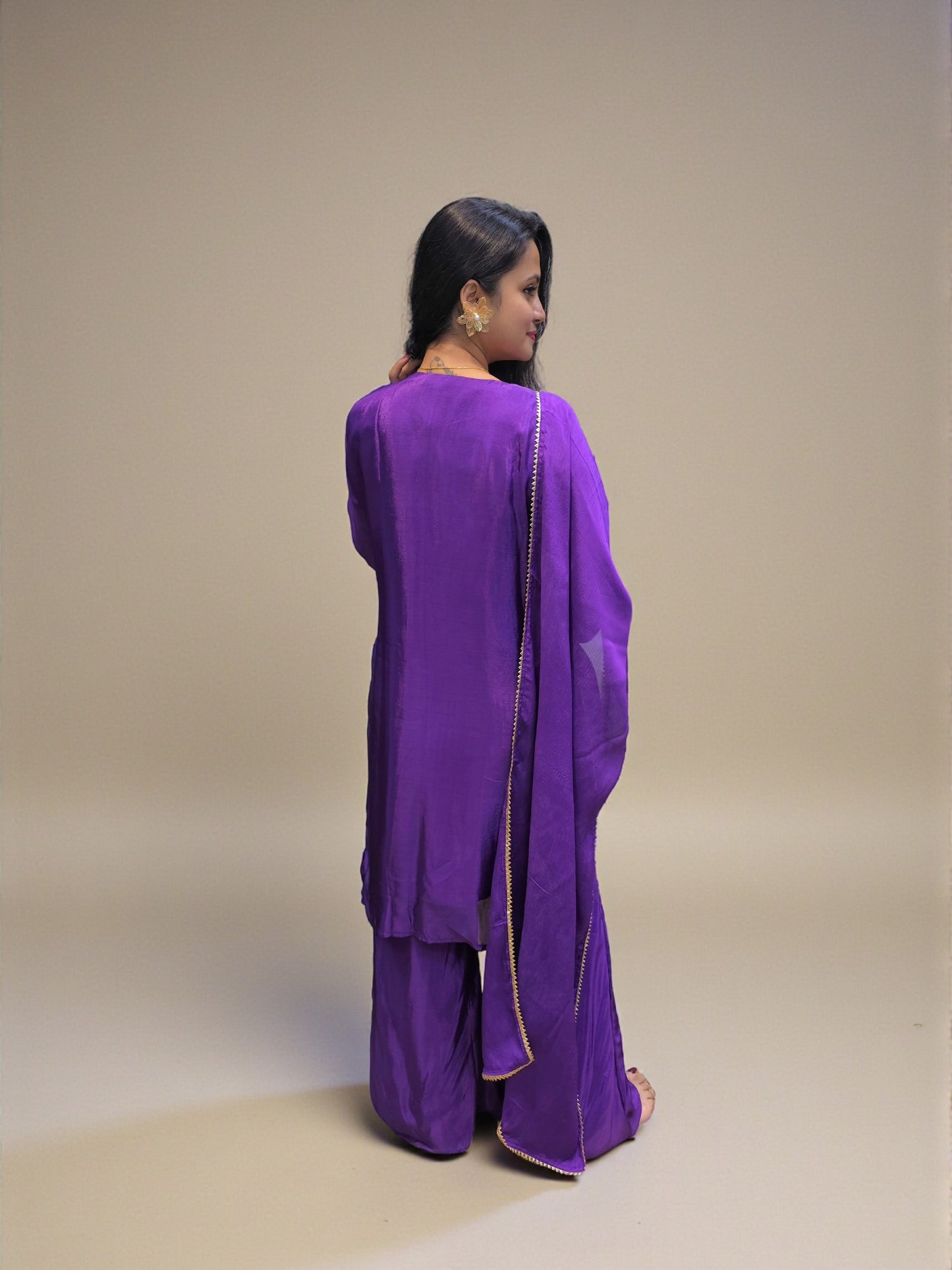back view of Ethnic purple hand embroidered kurta palazzo set for women