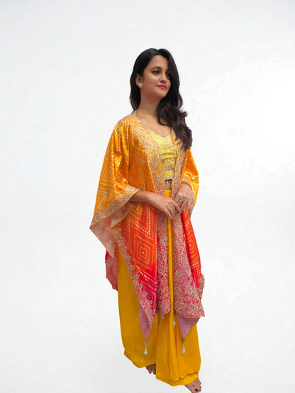 Stylish festive dhoti skirt for women in yellow with embroidered blouse and Cape