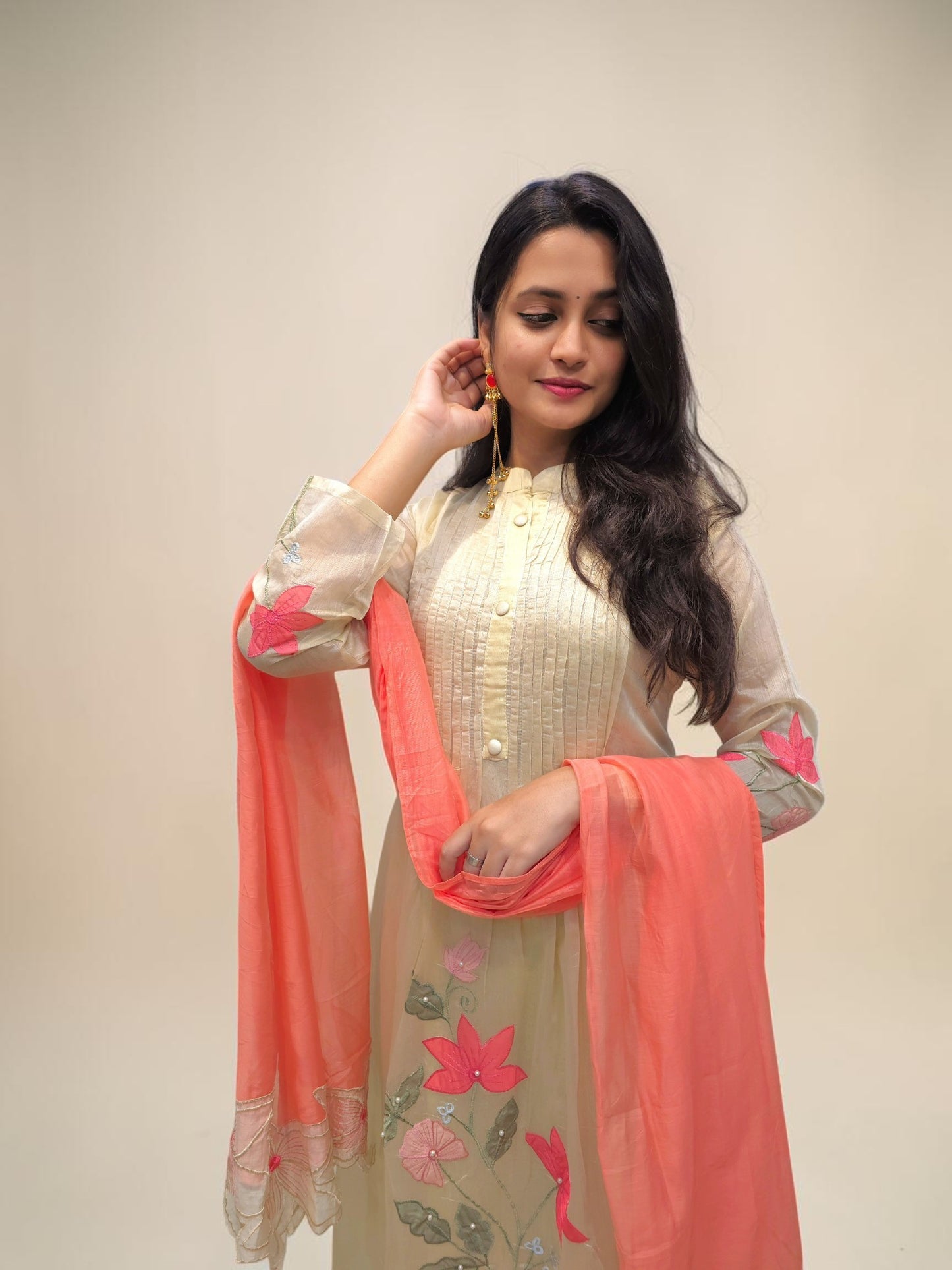 Pastel green embroidered A-line kurta with peach cutwork dupatta