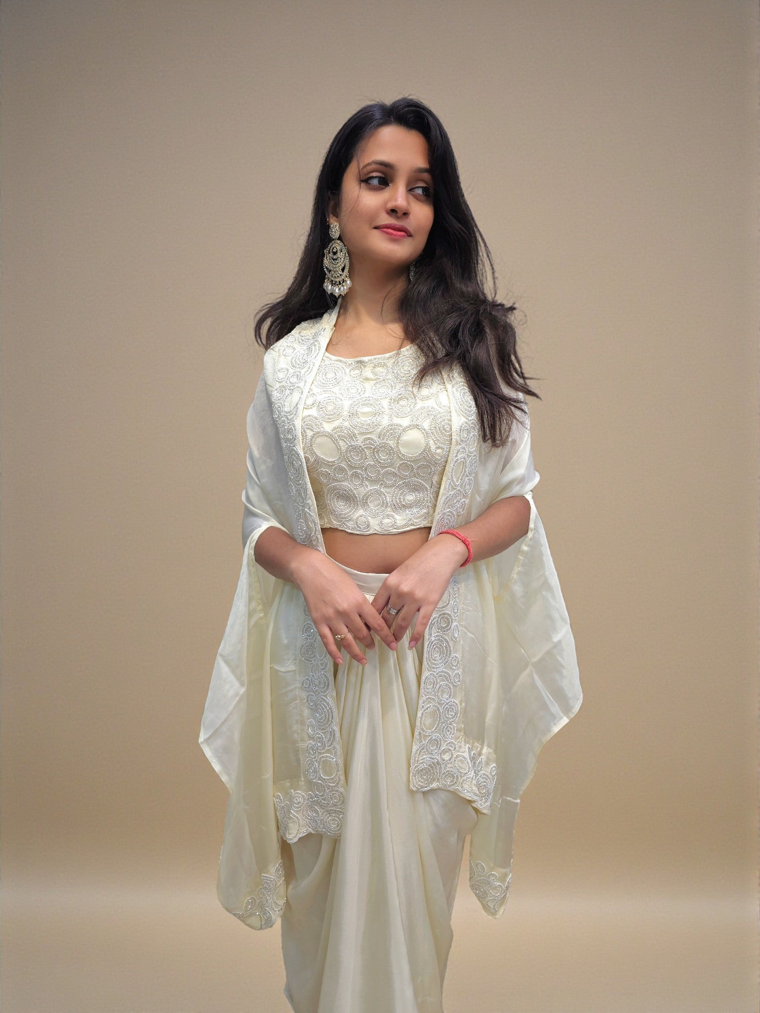 Elegant ivory indo-western crop top and dhoti skirt with cape