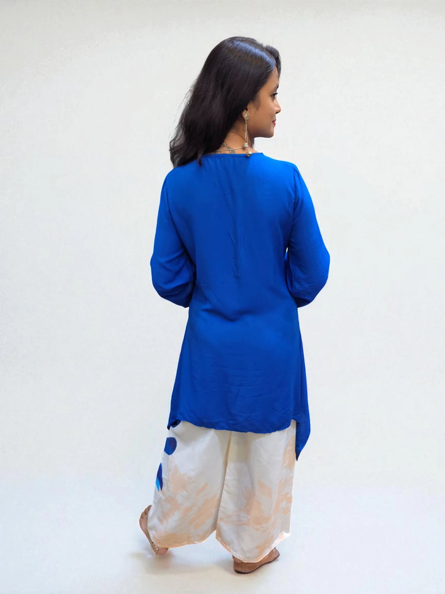back view of Modern Indo-Western outfit featuring blue C-cut top and printed pants, perfect for festive or casual wear.