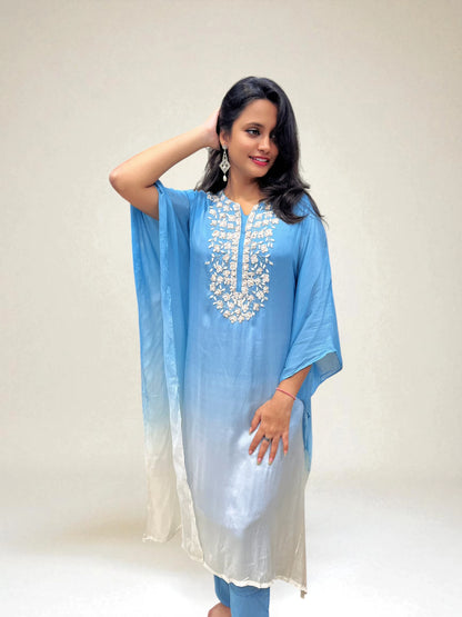 Model wearing ombre blue and white kaftan set with hand work from Ambika Boutique
