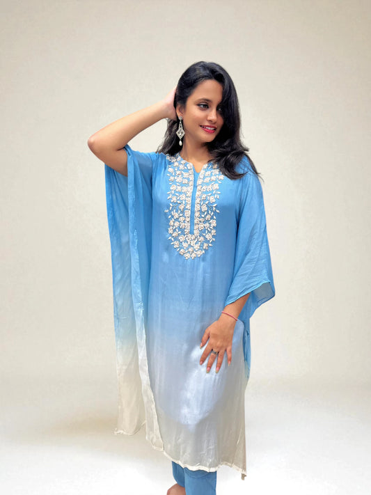 Model wearing ombre blue and white kaftan set with hand work from Ambika Boutique