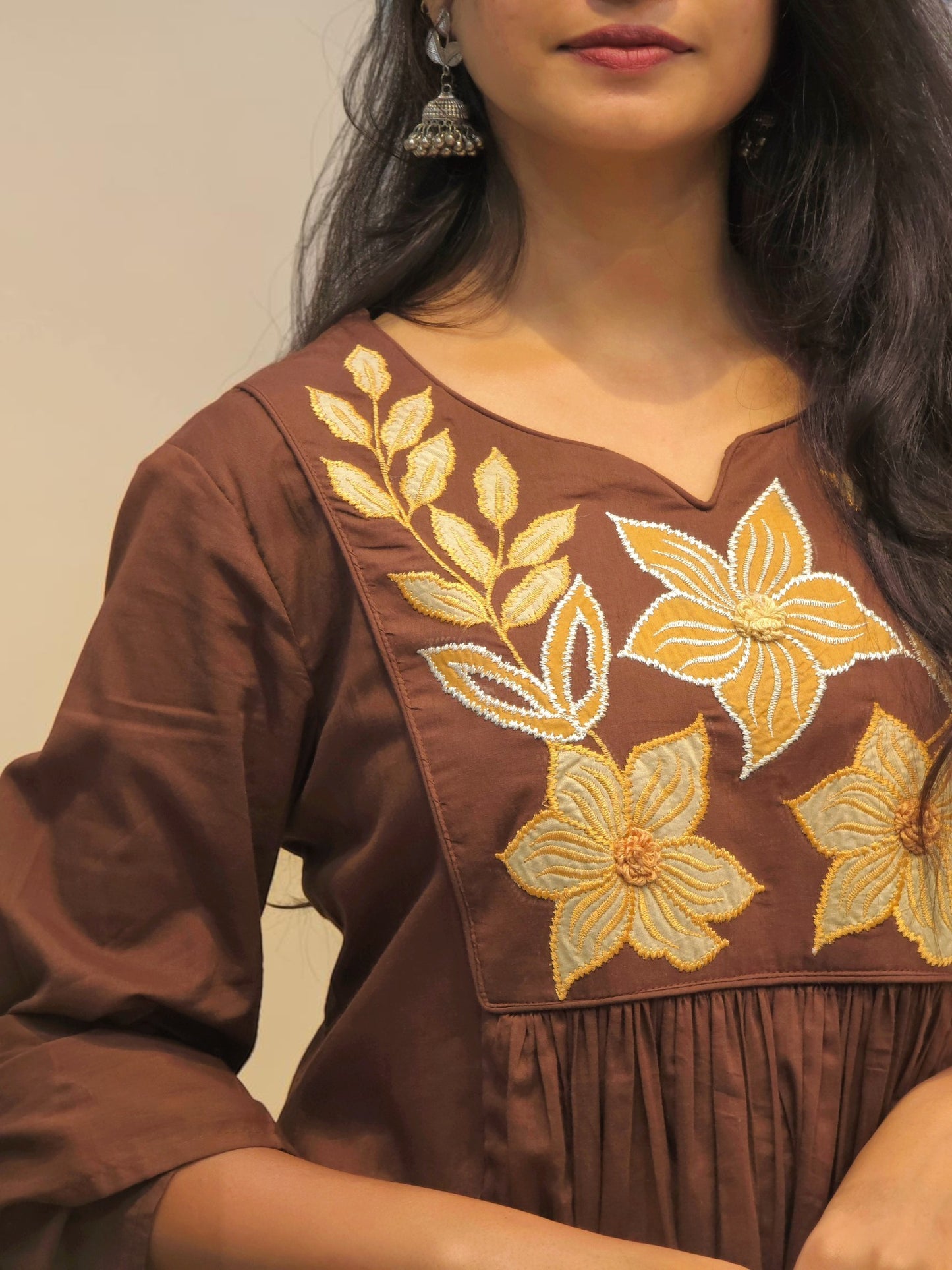 Brown festive Mul Cotton suit with embroidered floral motifs