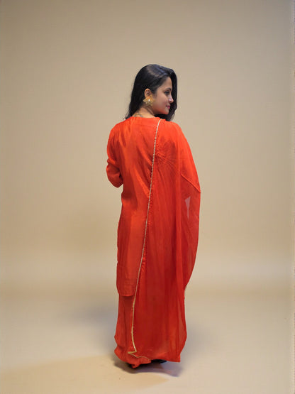 Premium rust orange kurta palazzo set featuring detailed hand embroidery