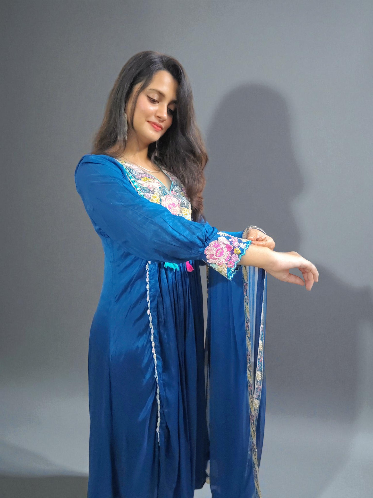 Traditional chinnon silk kurta set with detailed floral embroidery