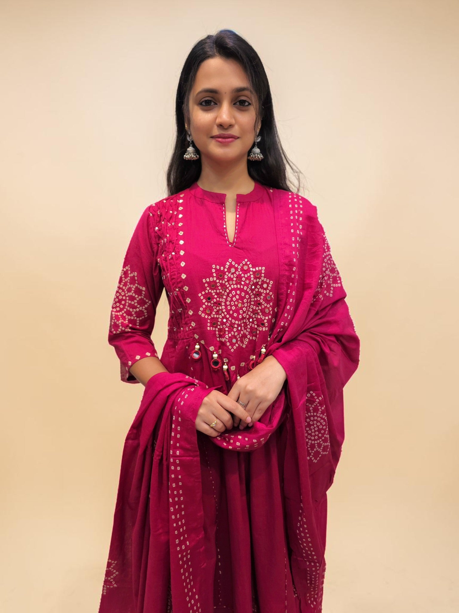 Designer pink cotton suit featuring traditional Bandhani motifs