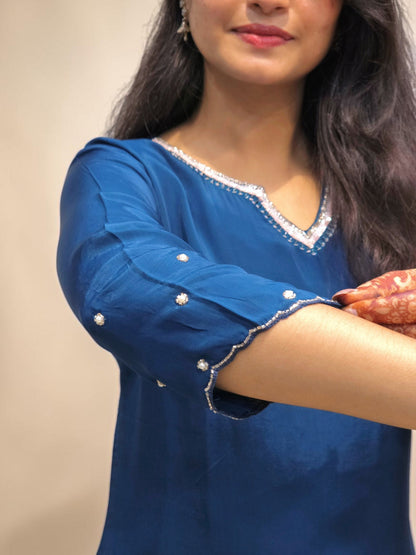 close up of Navy blue designer ethnic outfit with floral handwork