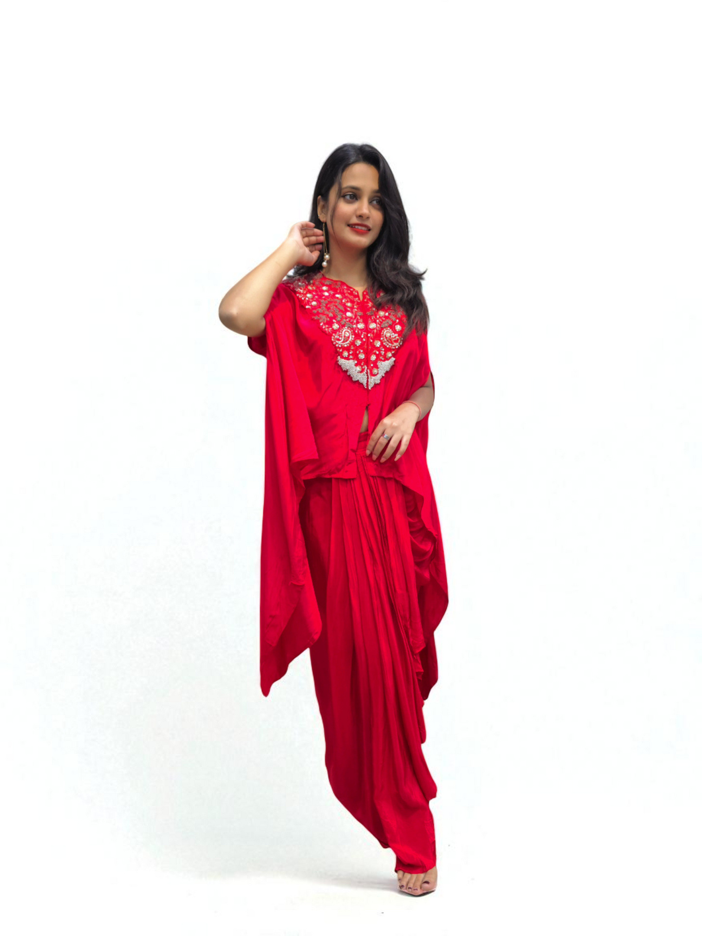 Woman wearing Designer Black Cape Dhoti Skirt Set with Hand Embroidery for festive occasions by Ambika Boutique.