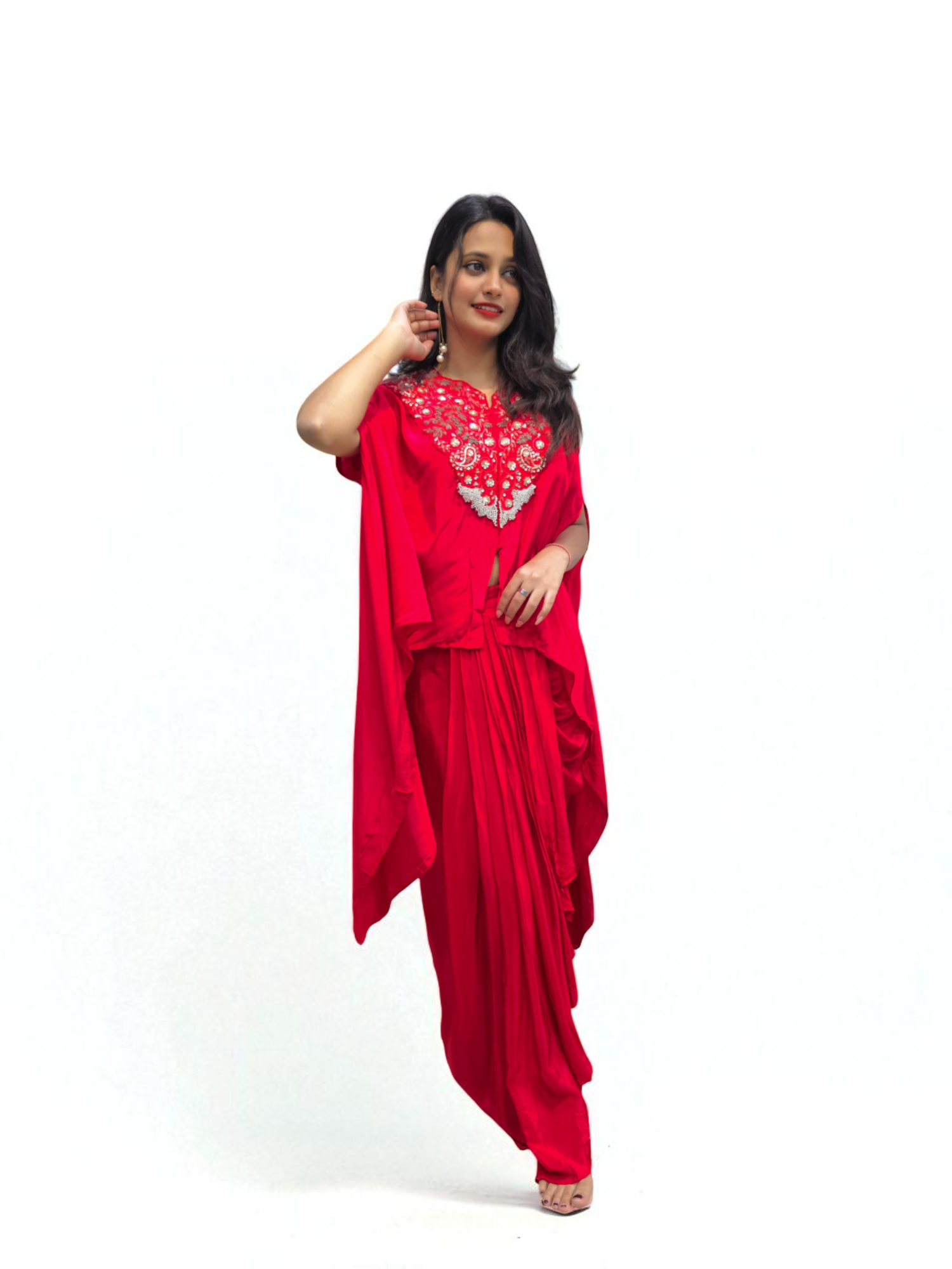 Woman wearing Designer Black Cape Dhoti Skirt Set with Hand Embroidery for festive occasions by Ambika Boutique.